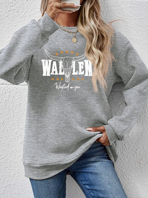 Grey graphic drop shoulder sweatshirt with bull skull and text detail.