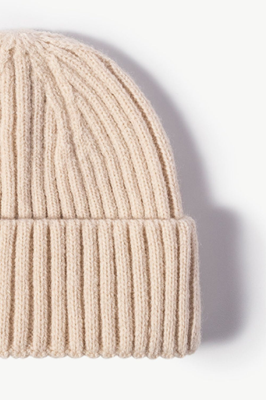Chunky ribbed knit beanie in cream acrylic with a cuffed hem.