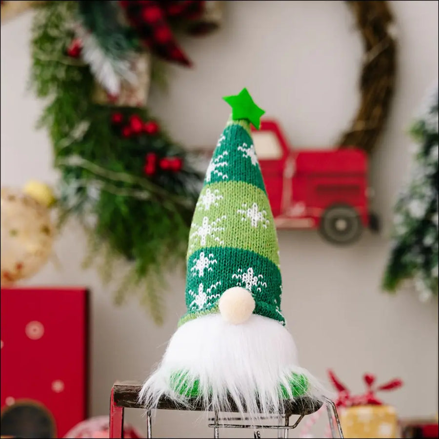 Illuminated Knit Gnome in green with snowflake pattern and white beard.