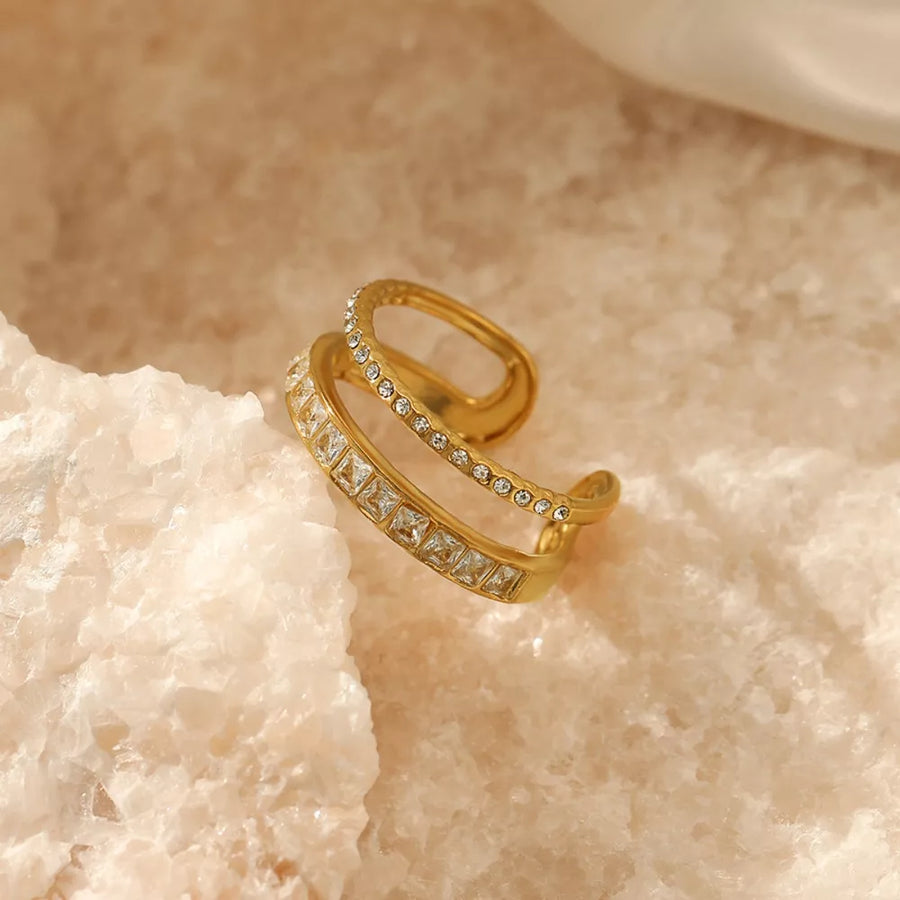 Gold-plated open ring with two bands, one set with square rhinestones and the other with round rhinestones.
