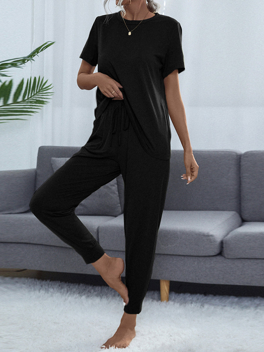 Black relaxed-fit tee and jogger lounge set with drawstring waist and cuffed ankles.