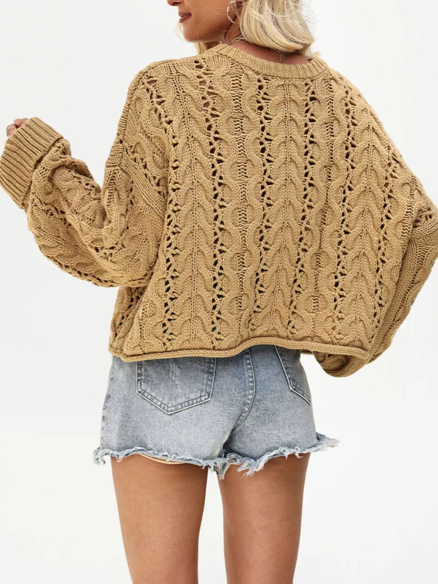pullover sweater in Black with cable-knit and cropped