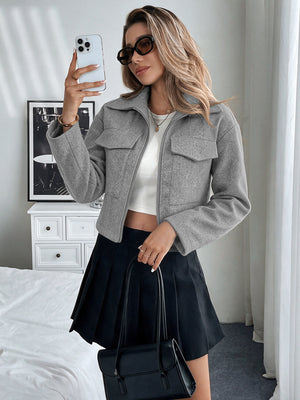 jacket in slate gray featuring flap pockets and boxy fit