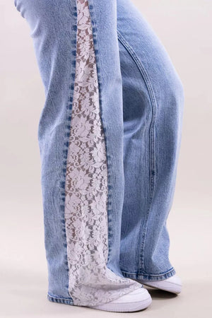 white wide-leg jeans featuring lace detail and floral
