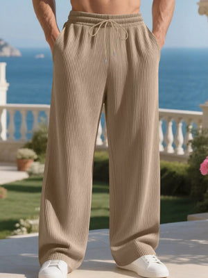 Khaki ribbed drawstring sweatpants with a relaxed fit and wide leg.