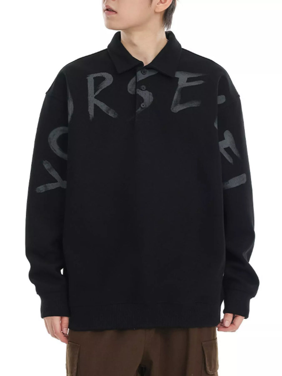 Black oversized polo sweatshirt with gray graphic letter print on chest and sleeves