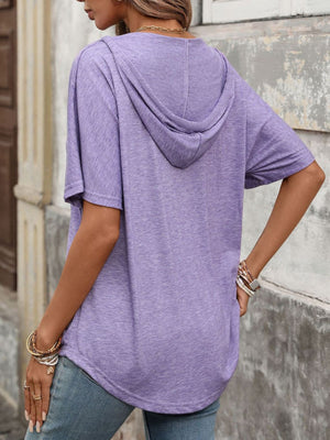 Purple hooded t-shirt with short sleeves and a relaxed fit.