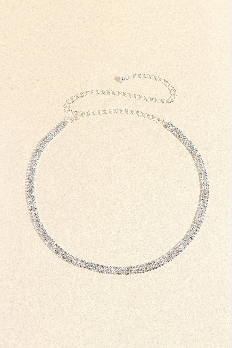 Triple-row crystal waist chain in silver with delicate chain extender.