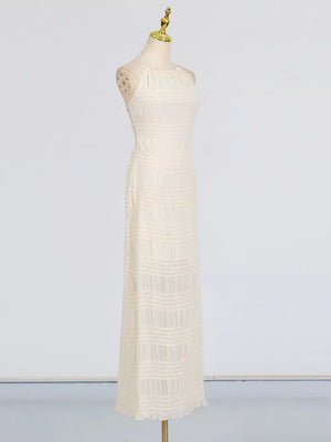Textured halter neck maxi dress in ivory with a ruched bodice and tiered skirt.