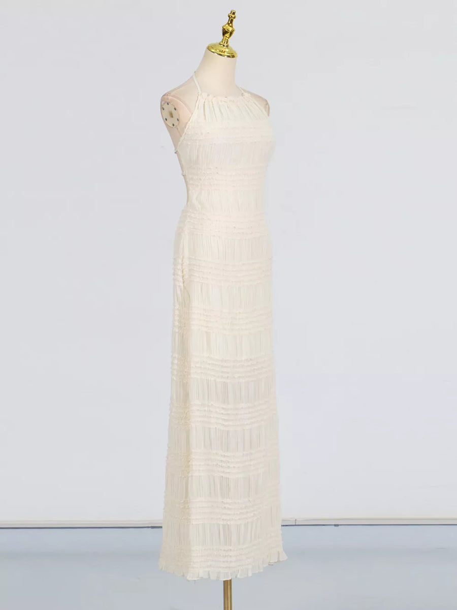 Textured halter neck maxi dress in ivory with a ruched bodice and tiered skirt.