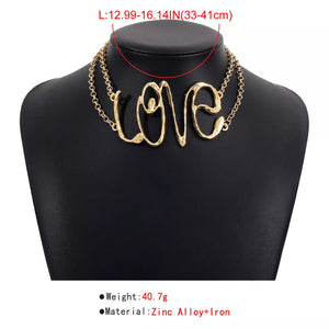 necklace in Gold with script and statement piece