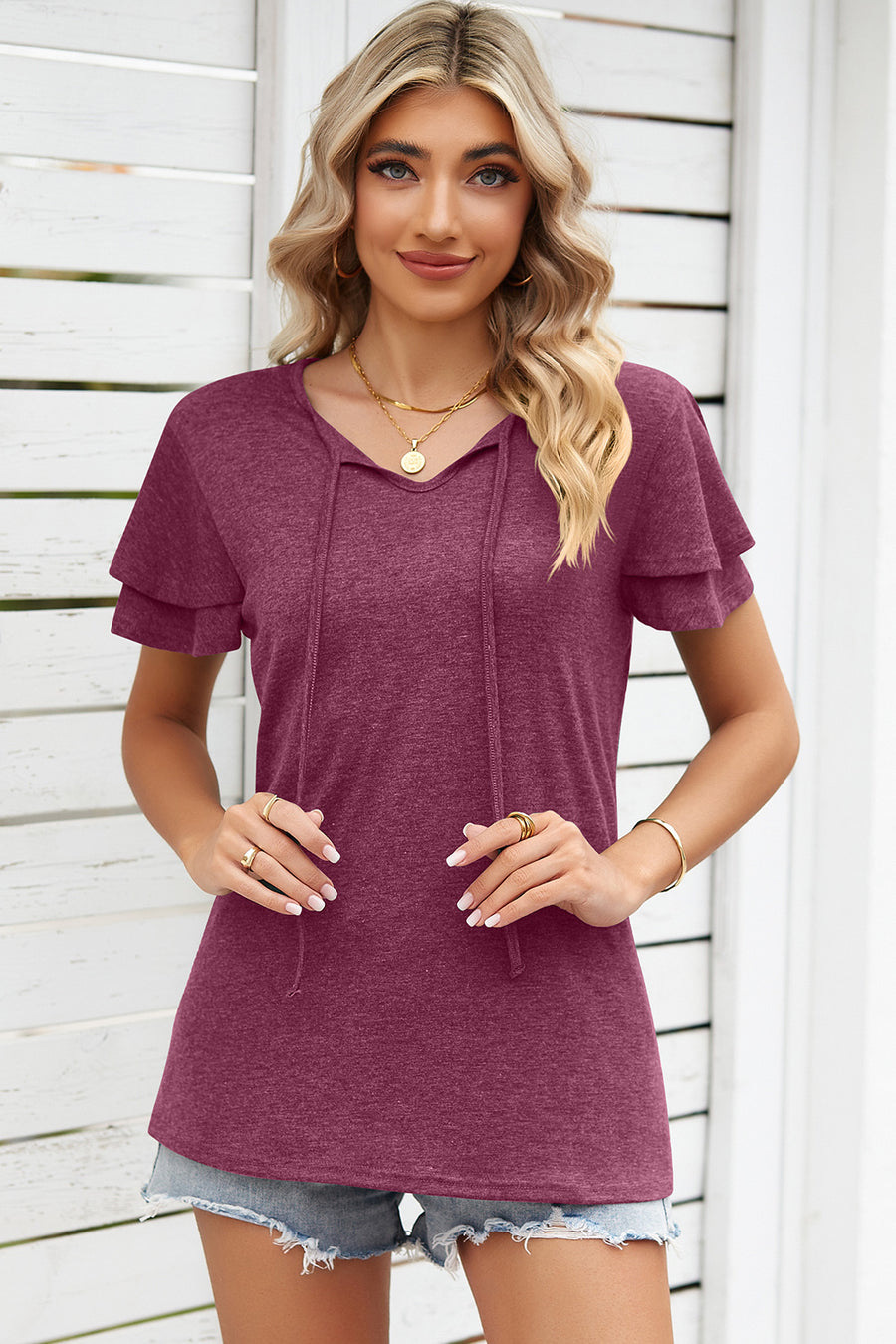 Burgundy flutter sleeve henley tee with tie-neck detail and layered short sleeves.