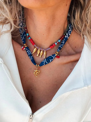 red necklace featuring 2-piece set and paisley