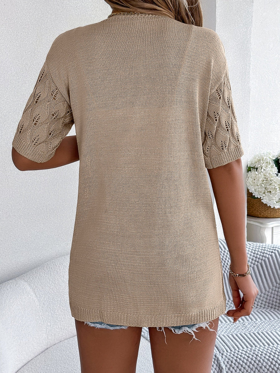 Tan open-knit cardigan with leaf motif sleeves and a crew neck.