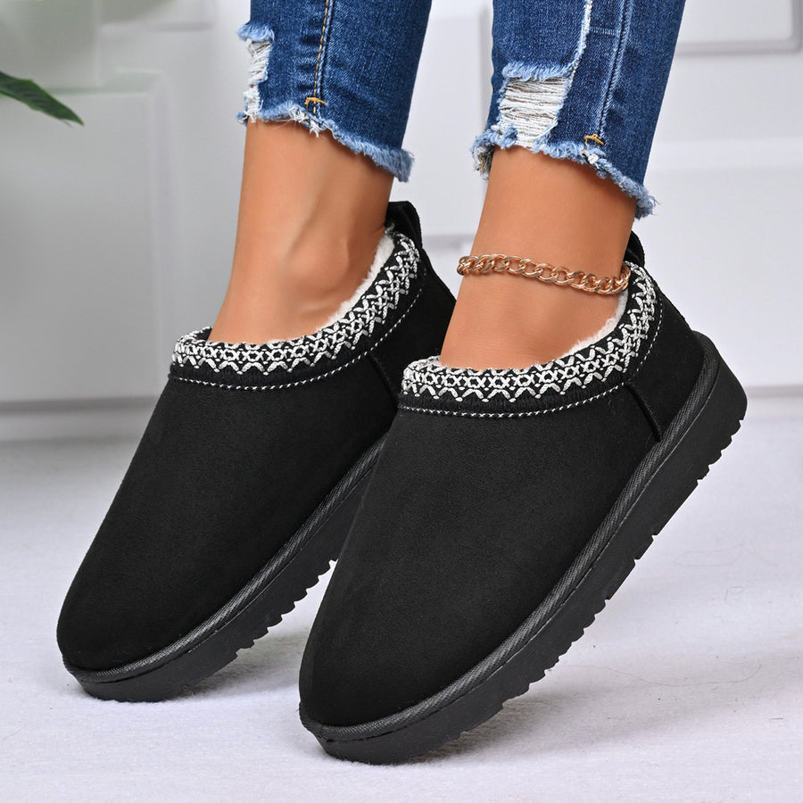 white ankle boots featuring round toe and geometric