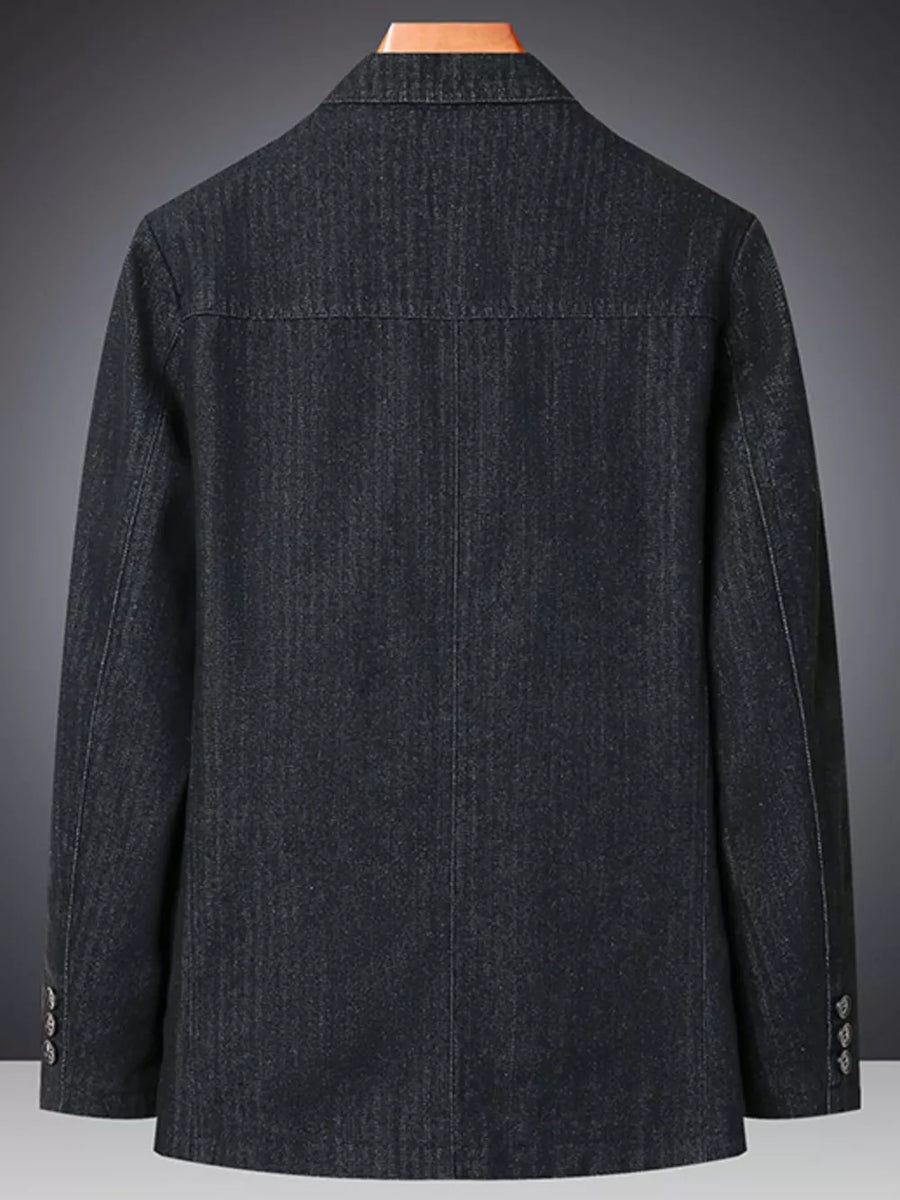 Textured dark blue denim blazer with notched lapels and buttoned cuffs.