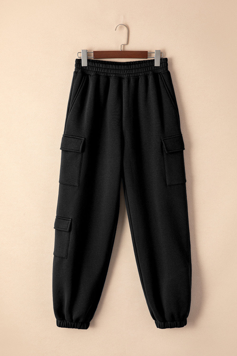 Black cargo pocketed relaxed joggers with elastic waistband and cuffs.