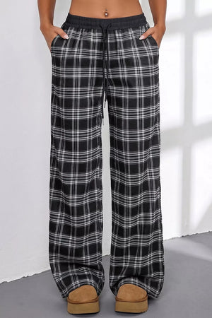 wide-leg pants in black with drawstring waist and full-length