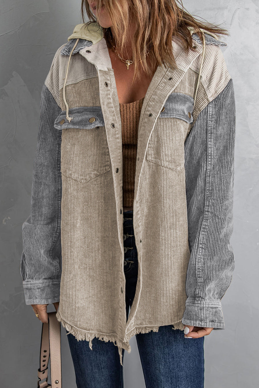 Colorblock corduroy hooded utility jacket with frayed hem and chest pockets.
