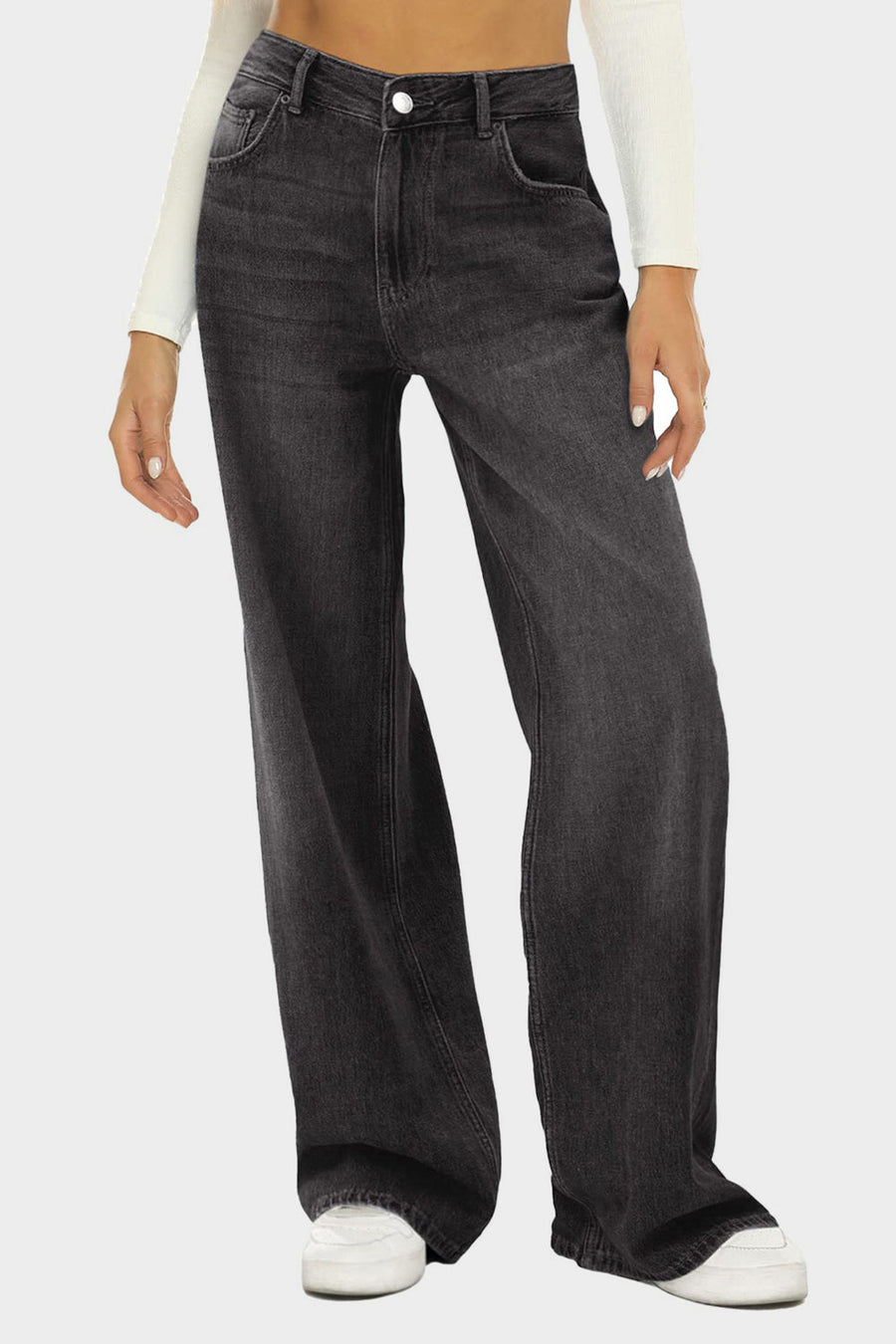 Black wide-leg denim jeans with subtle fade and button closure, styled casually.