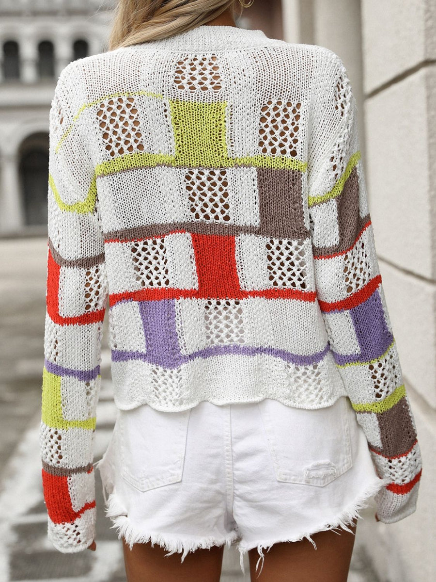 Patchwork openwork knit sweater with colorful blocks and open knit details.