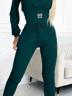 100% polyester Care instructions: Machine wash cold pullover hoodie in Green with relaxed silhouette