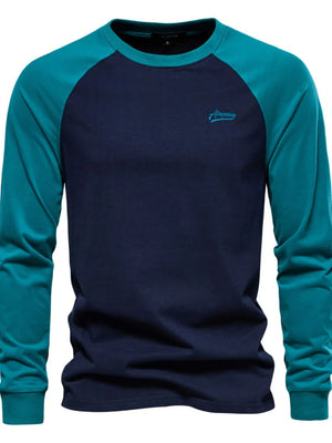 Navy and teal colorblock raglan tee with embroidered logo