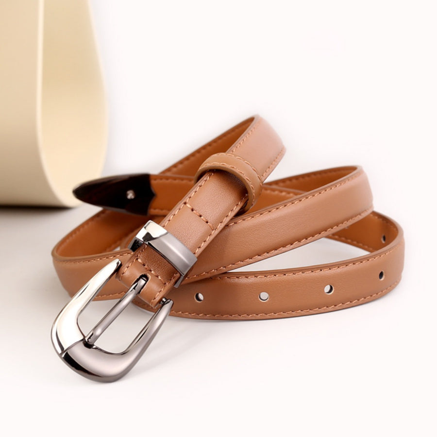 Caramel cowhide leather belt with a sleek metal buckle and stitching detail.