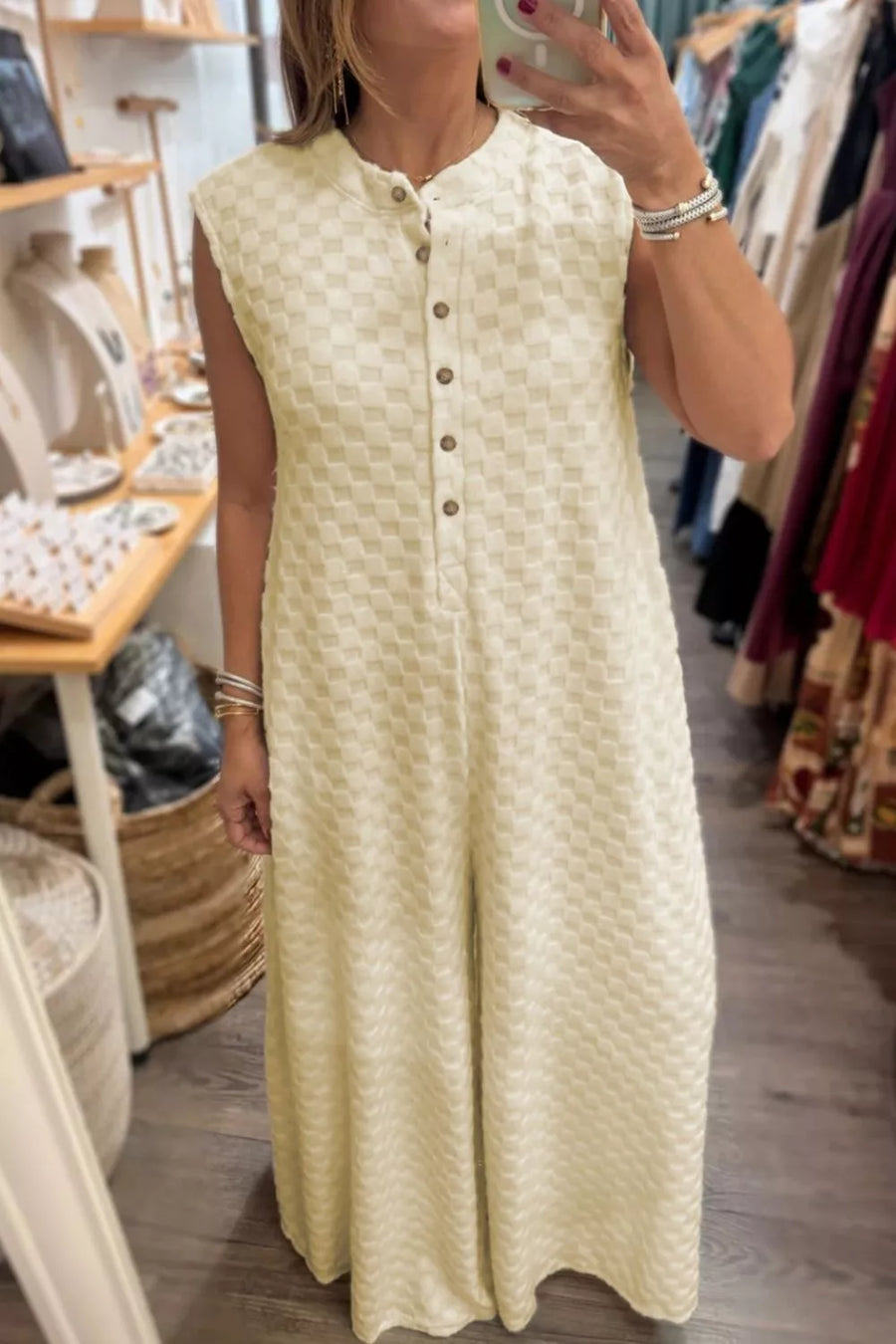 Cream checkered sleeveless wide-leg romper with band collar and button front