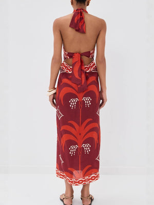 Tropical print halter neck maxi dress with cutout back and tie detail.
