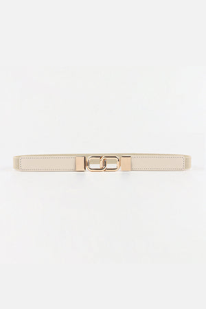 Cream elastic belt with linked rectangle gold buckle and gold end caps.