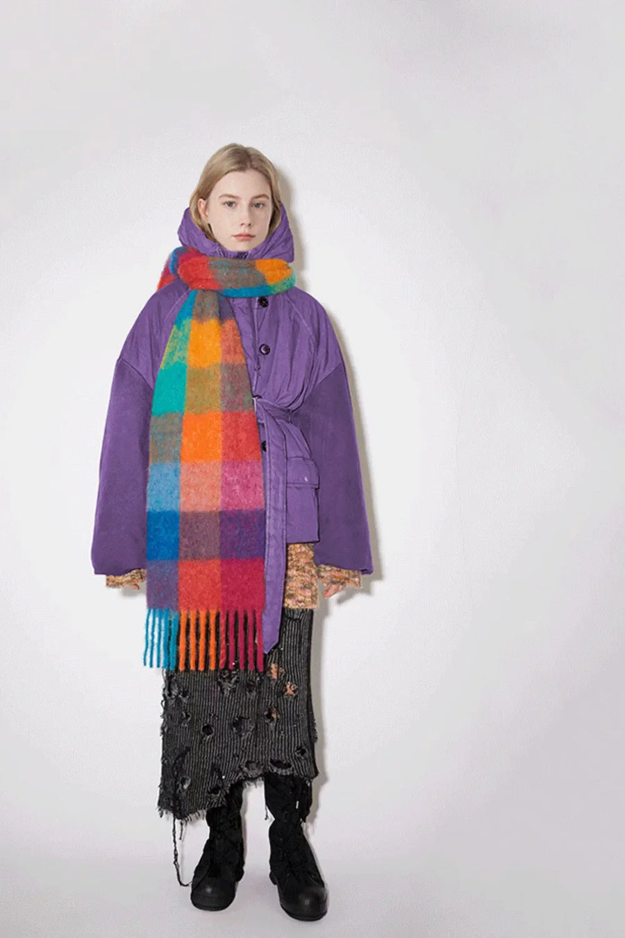 Checked plaid fringed winter wrap scarf in multicolor grid pattern with fringe detail.