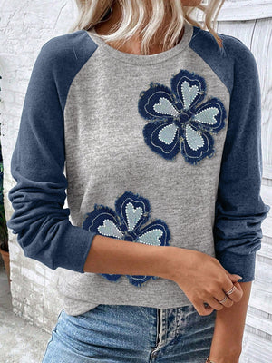 Grey raglan shirt with blue denim embroidered flower patches and long sleeves