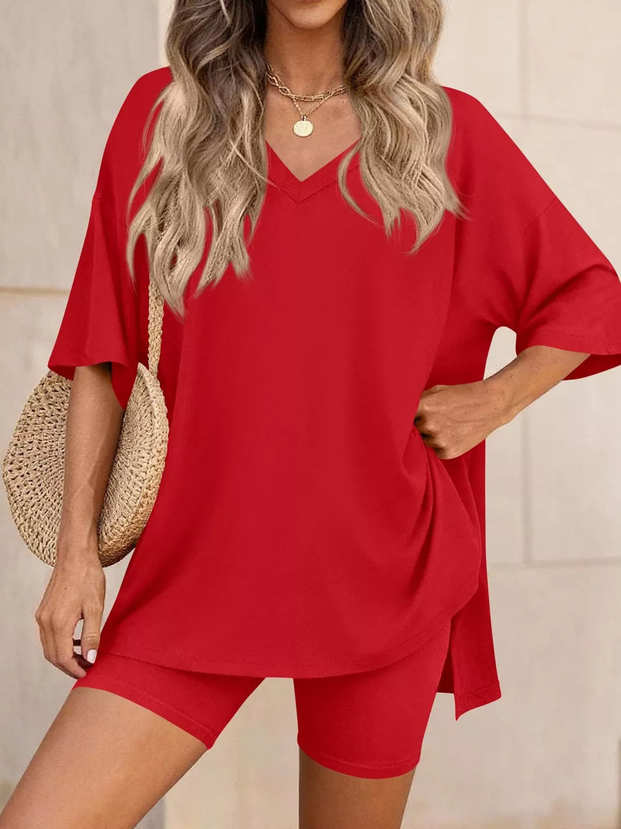 Red V-neck two-piece set with loose tee and bike shorts, casual comfortable women's outfit