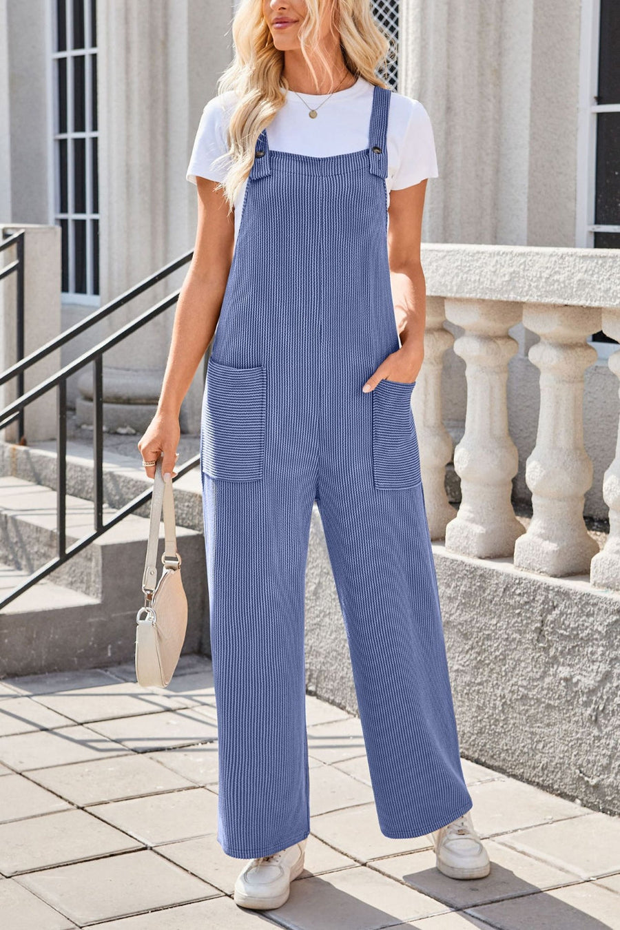 Dusty Blue striped denim overalls with patch pockets and wide legs.