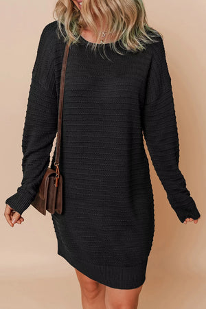 sweater dress in black featuring stretch and shift fit