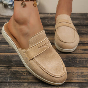 Khaki textured round toe slip-on loafers with backless design and strap detail.