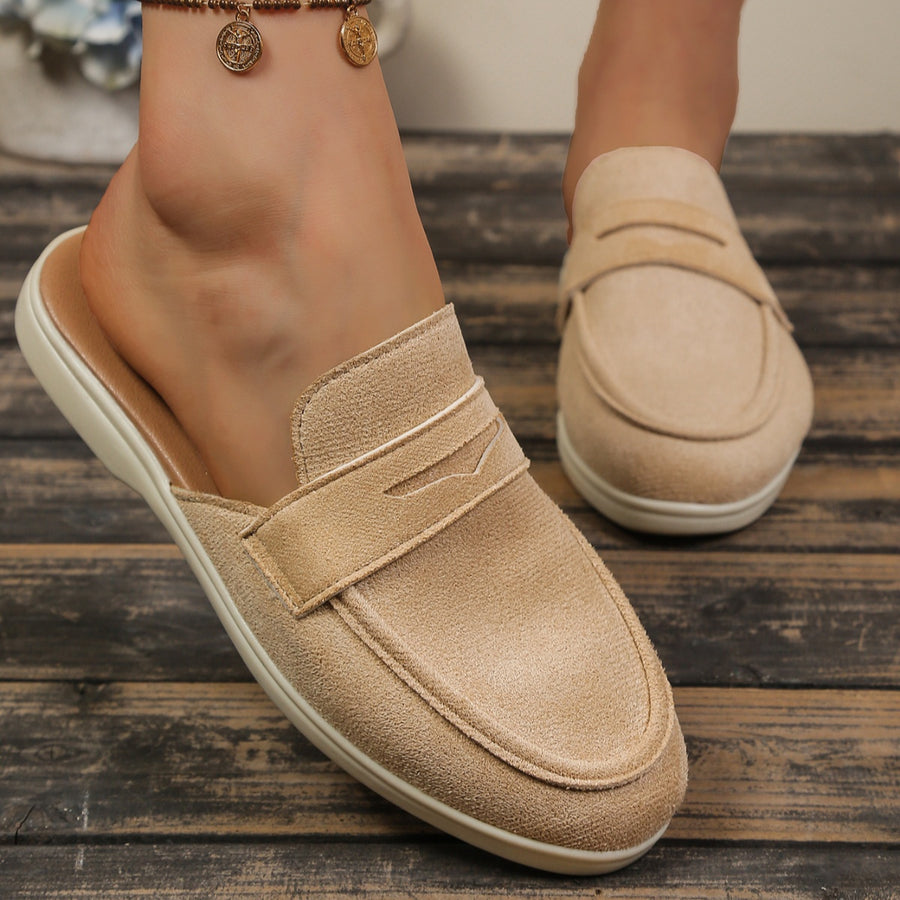 Khaki textured round toe slip-on loafers with backless design and strap detail.