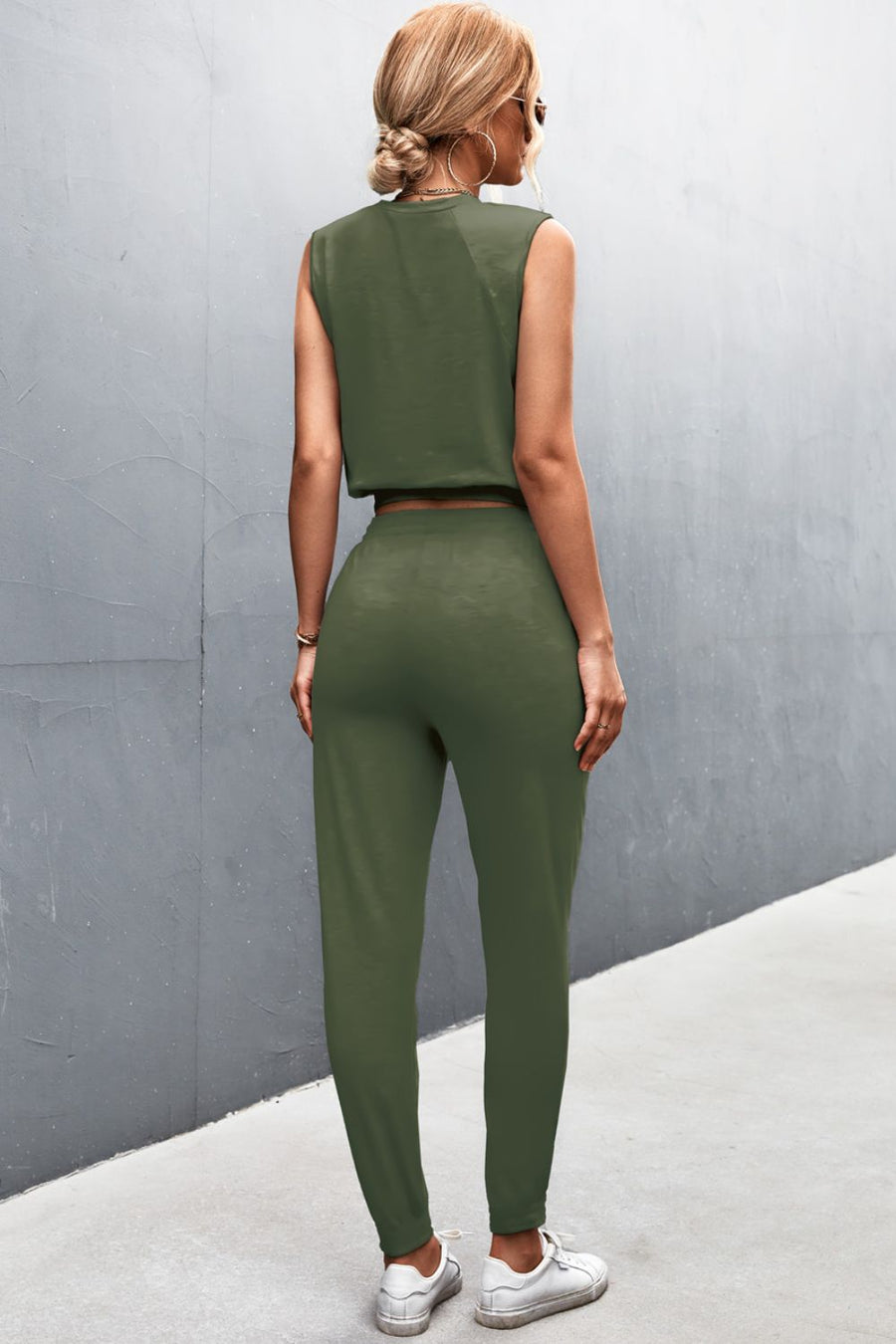 Army green cropped muscle tank and jogger set with a relaxed fit.
