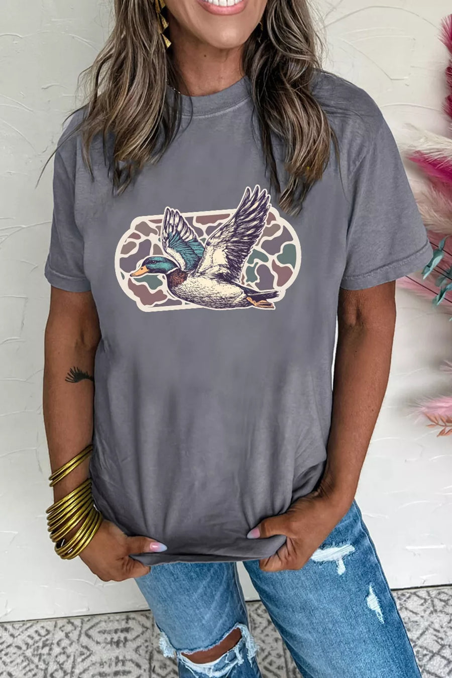 Gray polyester t-shirt with flying mallard duck graphic and camouflage background detail.