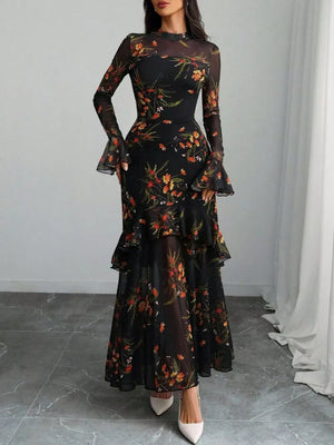 Black floral mermaid maxi dress with sheer flounce sleeves and tiered skirt.