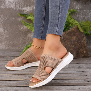 Khaki mesh slide sandals with open toe and white sole.