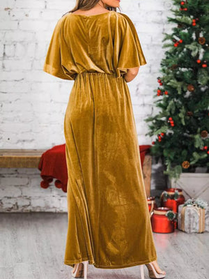 Gold velvet maxi dress with flutter sleeves and cinched waist.