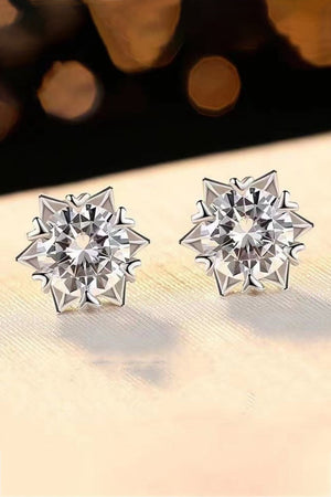Silver celestial cut moissanite stud earrings with starburst design