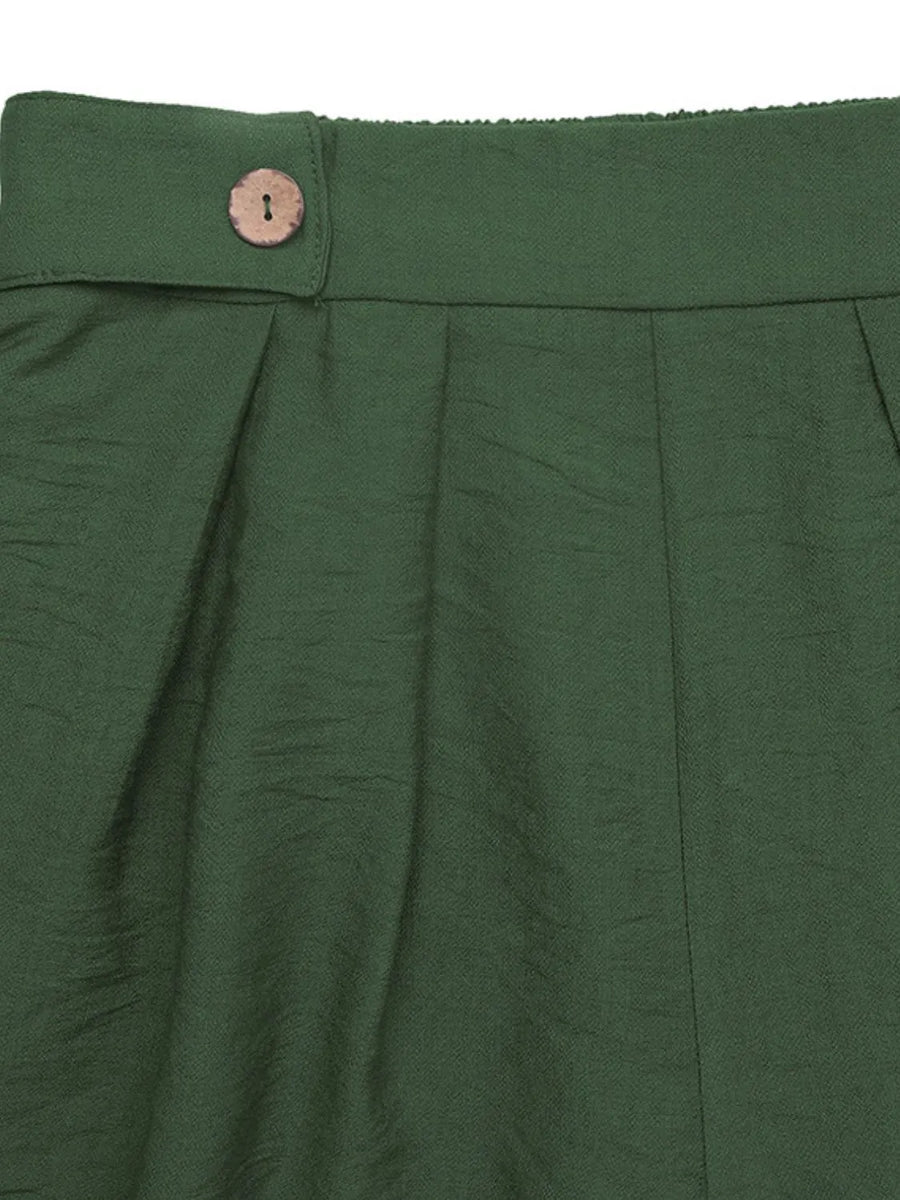Dark green high-waisted pleated shorts with a single button detail at the waist.