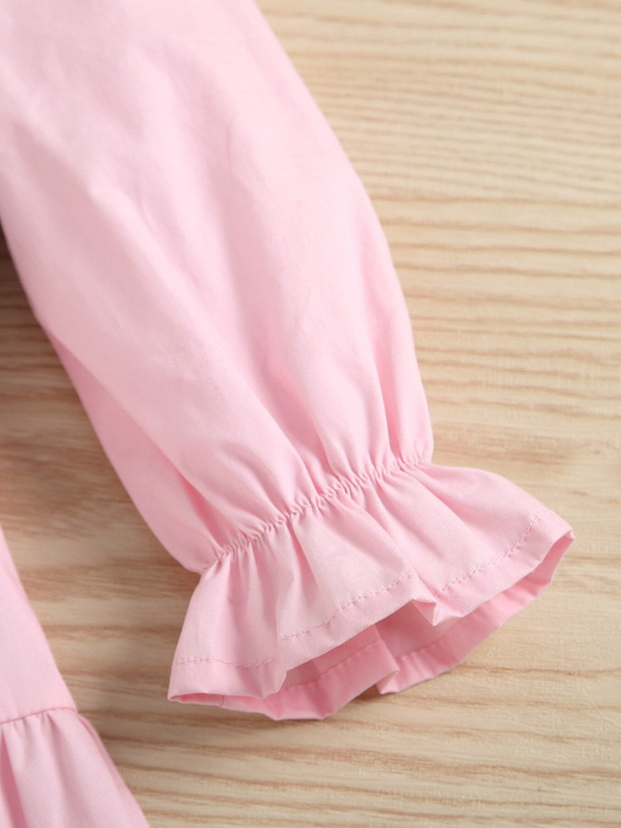 Pink cotton toddler dress sleeve with ruffled cuff detail