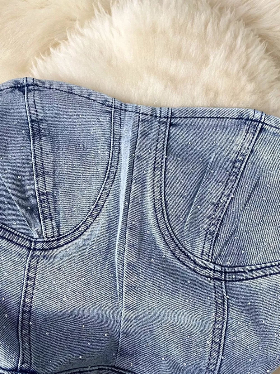 Blue denim bustier bodysuit with allover rhinestones and corset seams