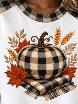 black sweatshirt featuring raglan sleeve and plaid