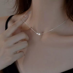 necklace in silver featuring pearl accent and straight fit