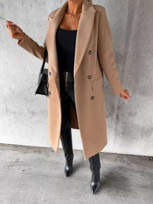Chic double-breasted longline trench coat in apricot with button details.